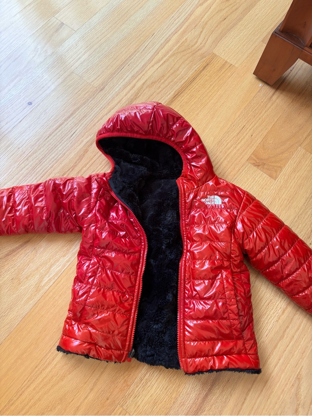 The North Face Kids Shiny Red Puffer Jacket with Black Sherpa Lining